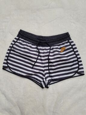 Nike Women's Black & White Striped Athletic Shorts with Gold Logo